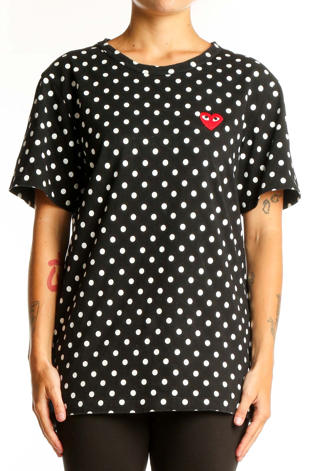 Front view of PLAY Comme Des Garçons black polka dot t-shirt with red heart logo