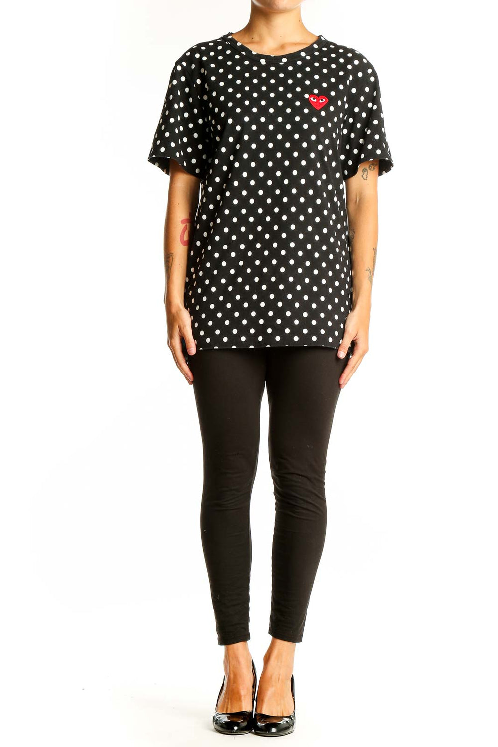 Front view of PLAY Comme Des Garçons black polka dot t-shirt with red heart logo