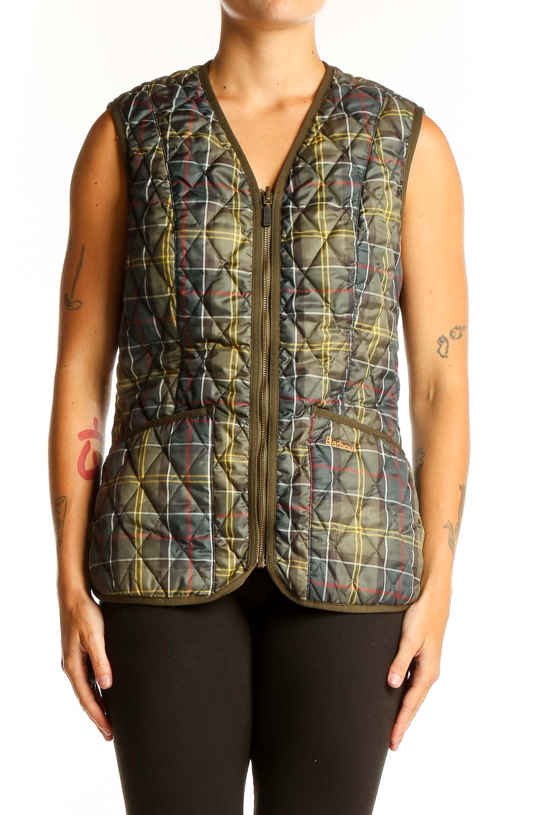 Front view of olive Barbour quilted vest with camo print
