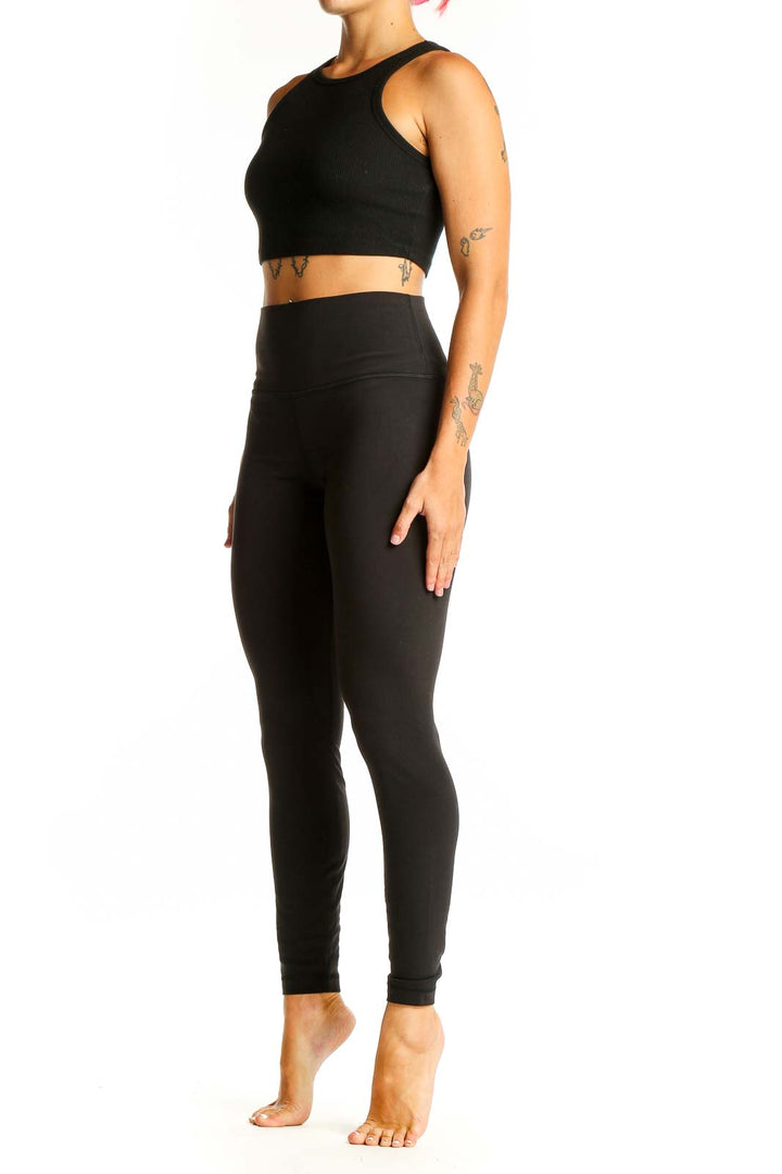 Front view of black Lululemon high-waisted performance leggings