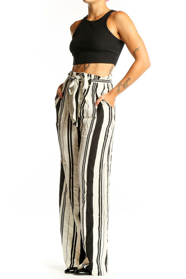 Front view of Chelsea 28 black and white striped wide-leg pants with paper bag waist