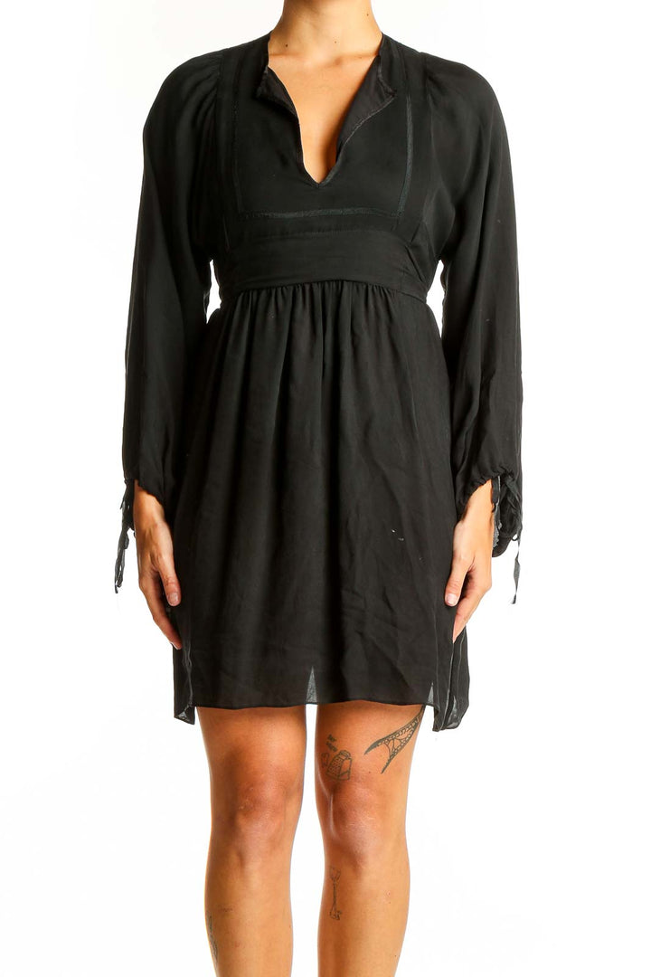 Front view of black Betsey Johnson dress with V-neck and empire waist
