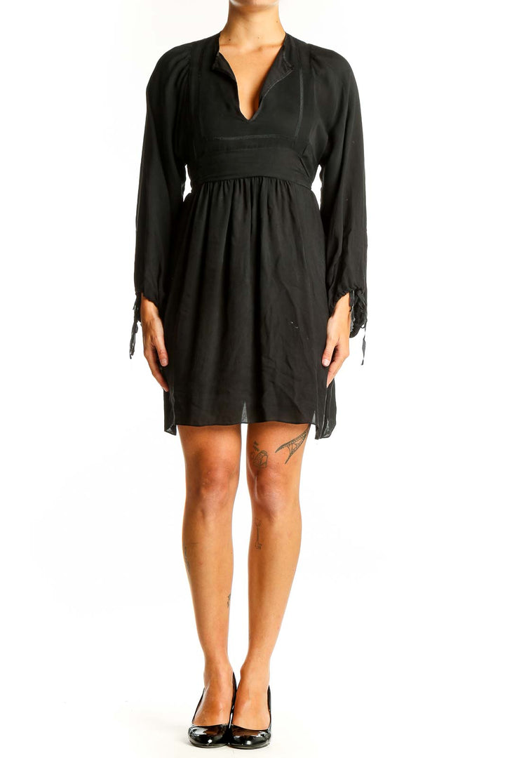 Front view of black Betsey Johnson dress with V-neck and empire waist
