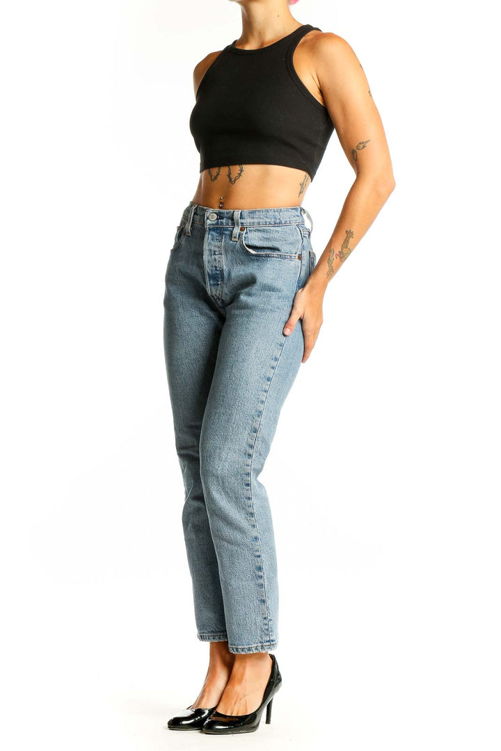 Front view of Levi's light blue straight leg jeans on model