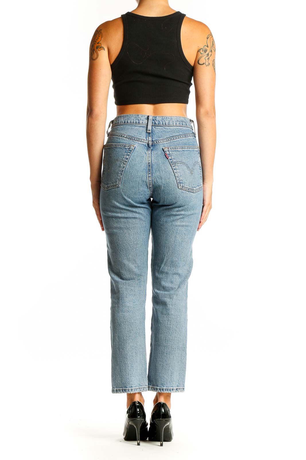 Back view of Levi's light blue straight leg jeans on model