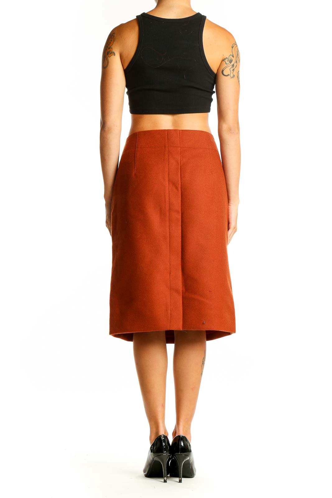 Side view of model wearing J.Crew rust pencil skirt with black top