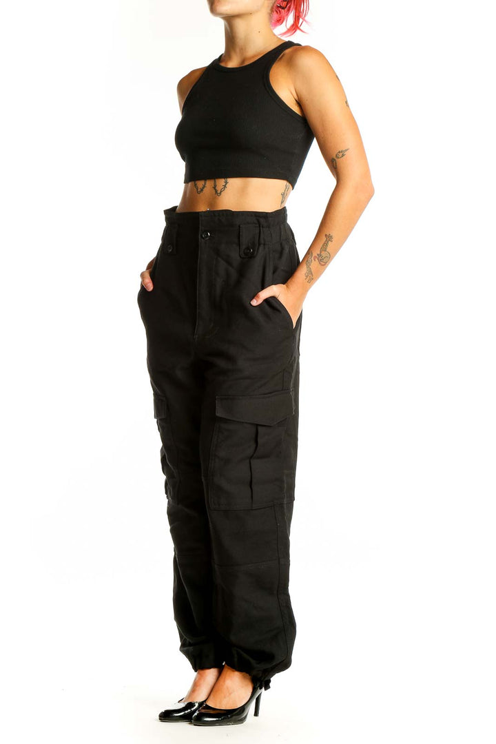 Front view of Banana Republic black wool cargo pants with multiple pockets