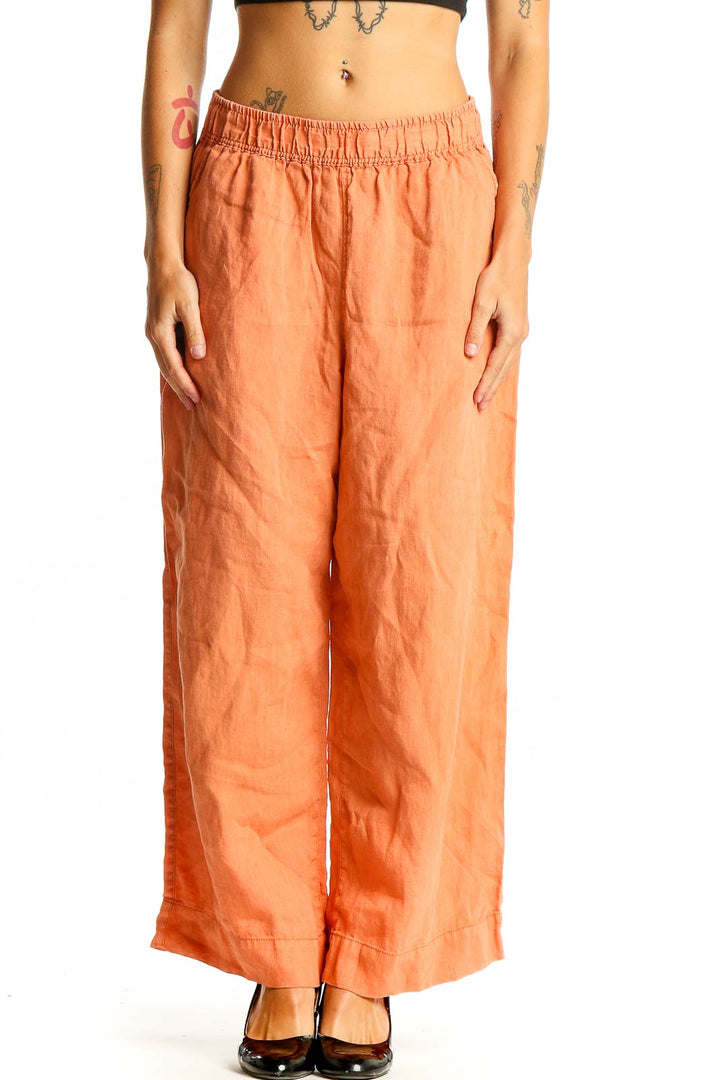 Front view of Tahari orange linen wide-leg pants with elastic waistband