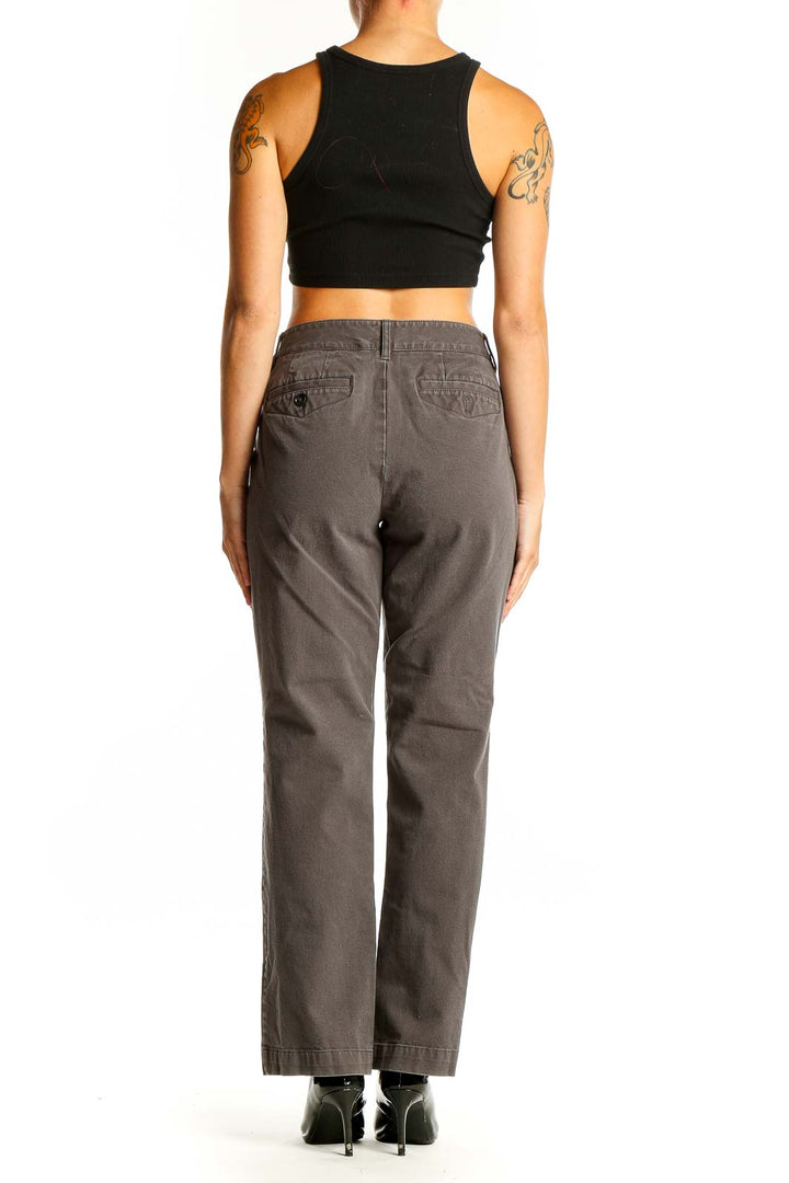 Side view of woman wearing Eddie Bauer gray straight leg pants with black top