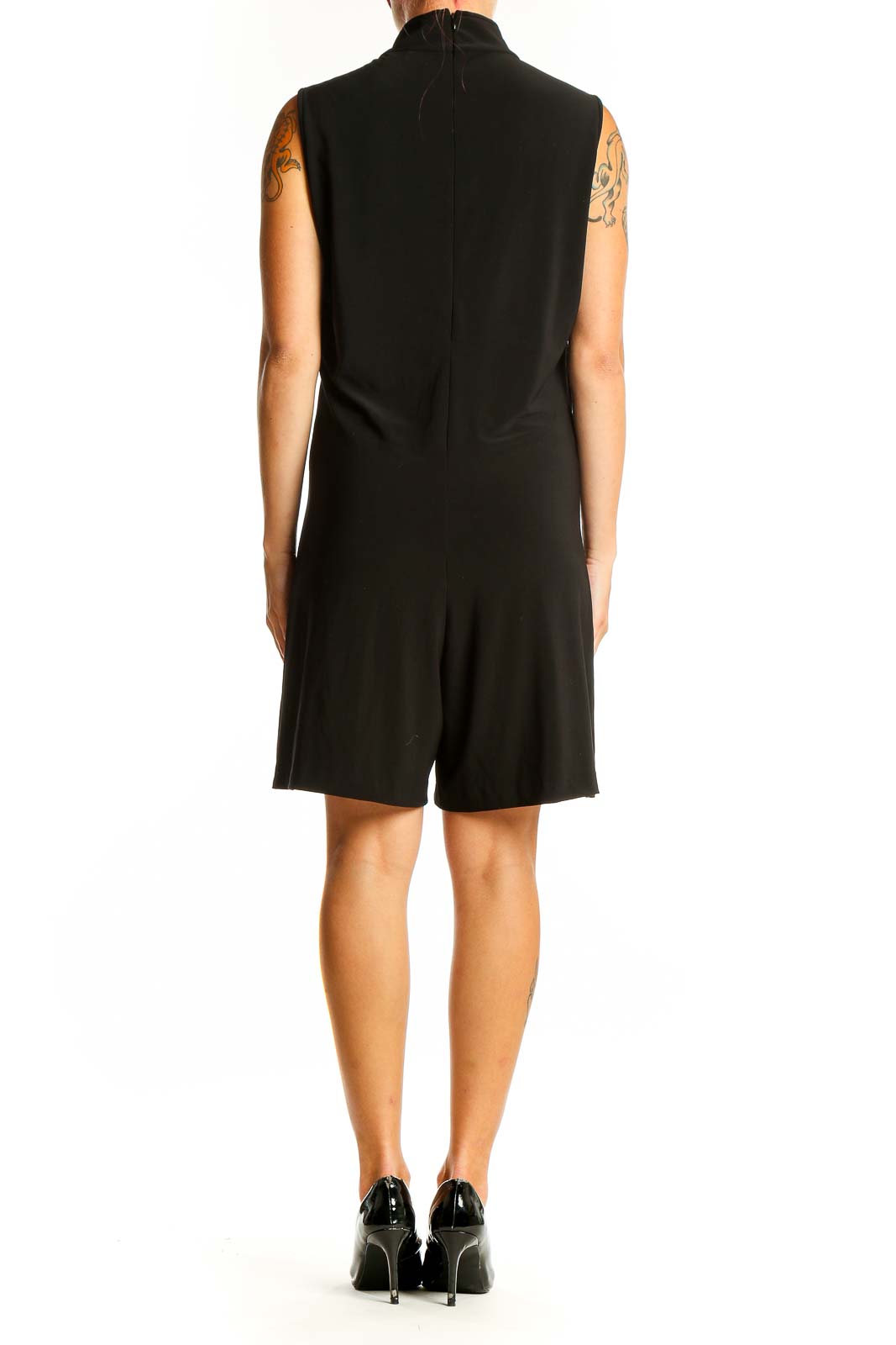 Side view of NORMA KAMALI black sleeveless jumpsuit showing silhouette