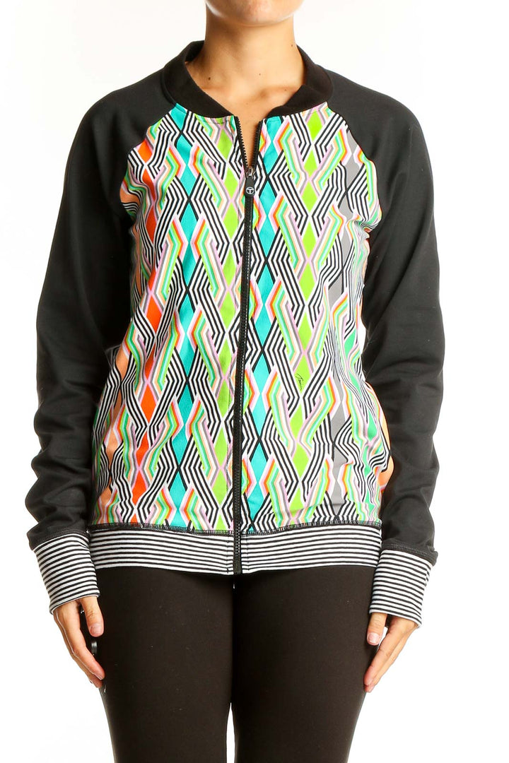 Front view of Trina Turk multicolor geometric print activewear jacket with black sleeves