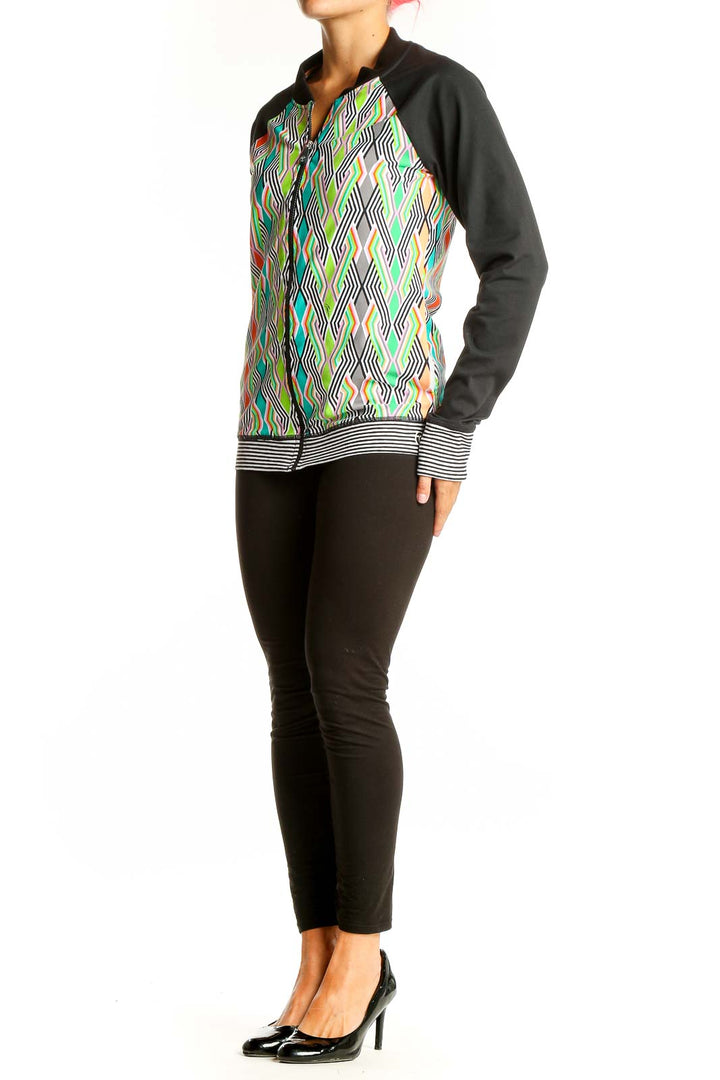 Front view of Trina Turk multicolor geometric print activewear jacket with black sleeves