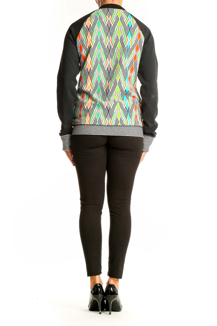 Back view of Trina Turk multicolor geometric print activewear jacket showing full pattern
