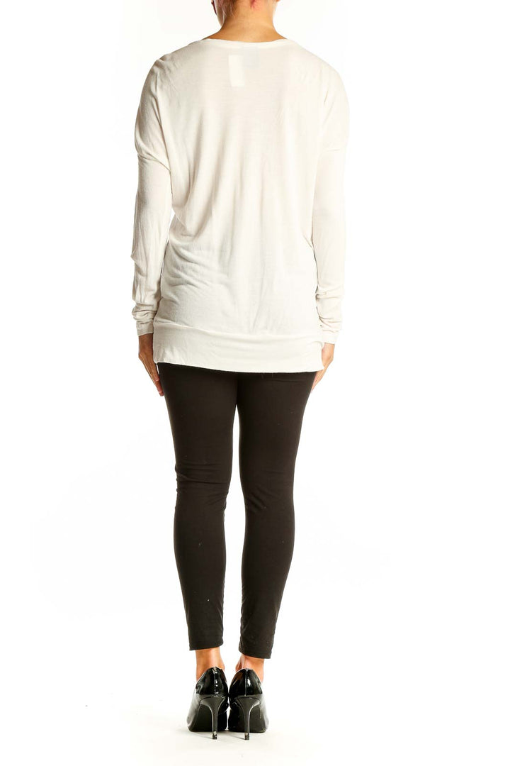 Side view of Missoni white viscose long-sleeve top showing ruffle detail and fit