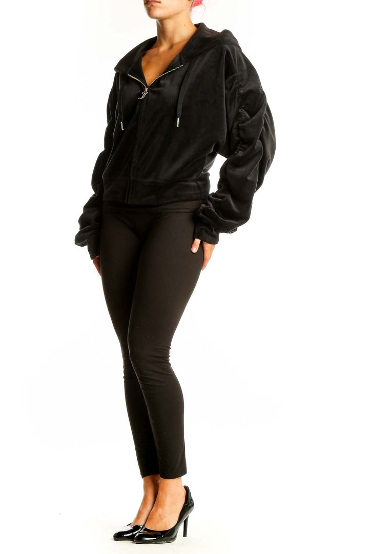 Front view of Juicy Couture black velour zip-up hoodie jacket
