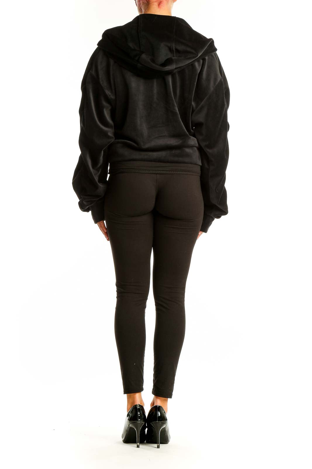 Back view of Juicy Couture black velour zip-up hoodie jacket on model