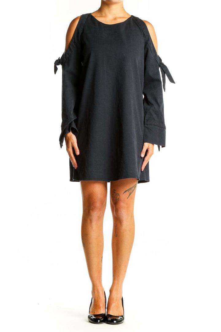 Front view of black Zara Trafaluc mini dress with cold shoulders and tie-sleeves