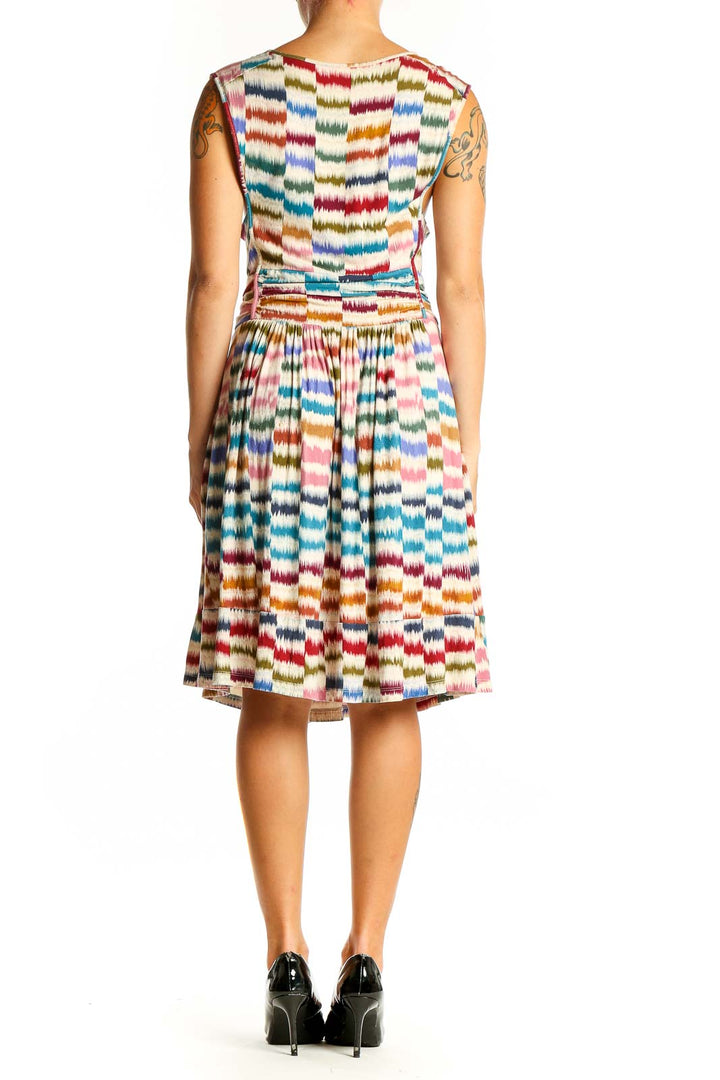 Side view of Maeve multicolor striped sleeveless midi dress showing gathered waist and flowy skirt