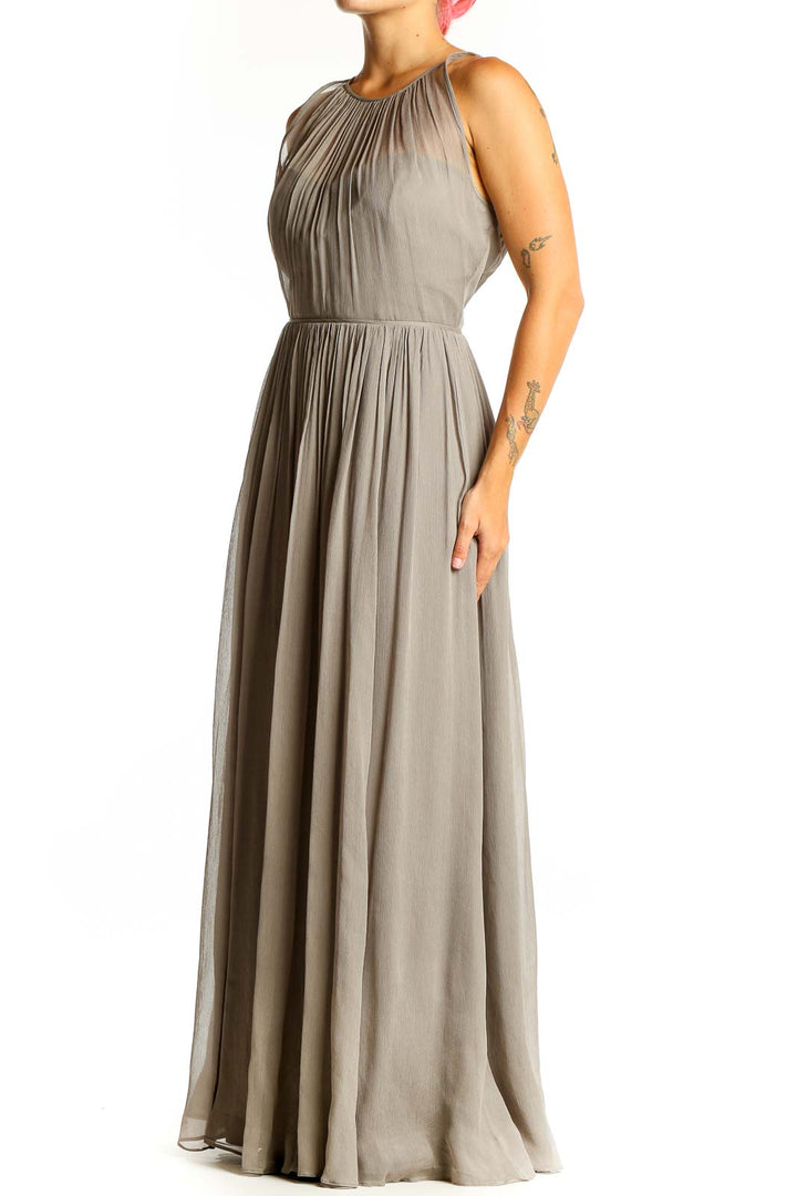 Front view of taupe J.Crew pleated chiffon maxi dress with gathered neckline