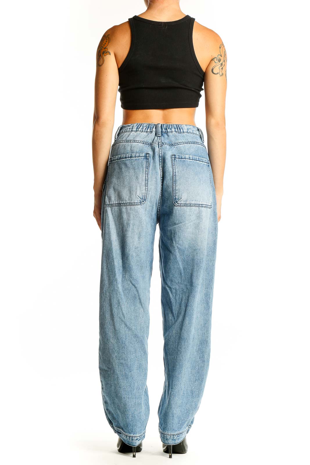 Side view of model wearing Elan light blue wide-leg carpenter jeans