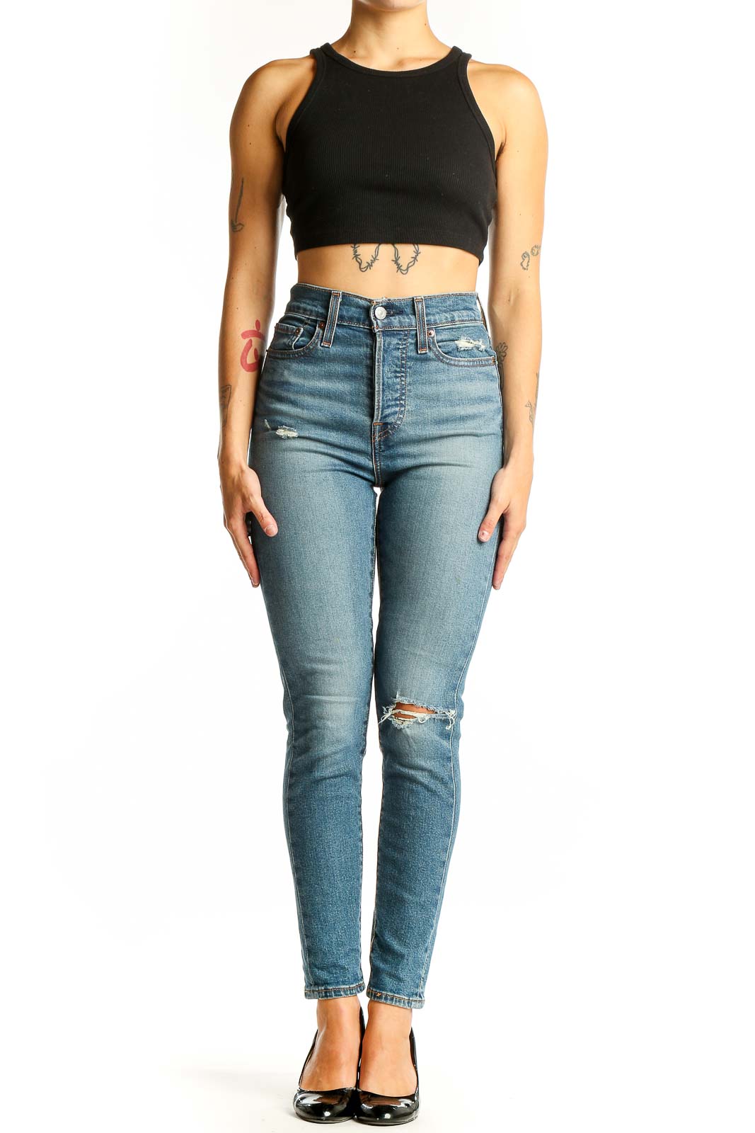 Front view of Levi's light blue high-waist skinny jeans with distressing