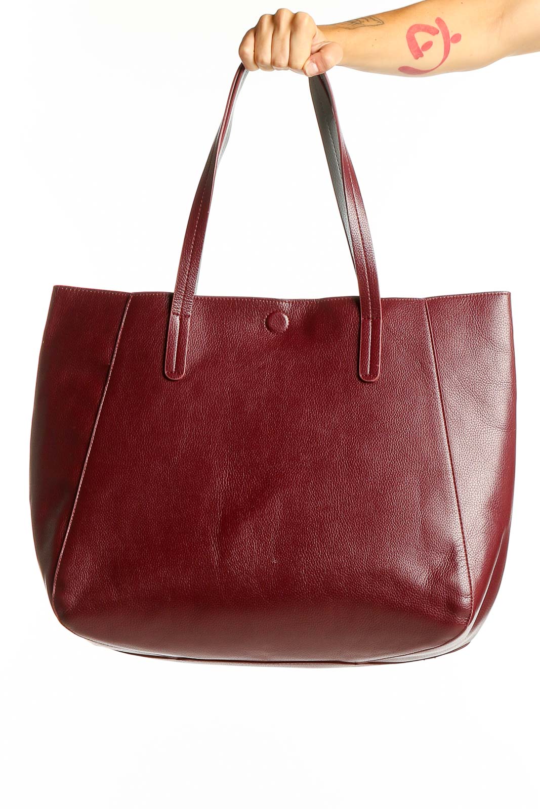 Front view of burgundy leather tote bag with long handles
