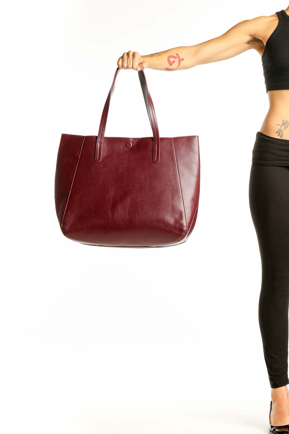 Front view of burgundy leather tote bag with long handles