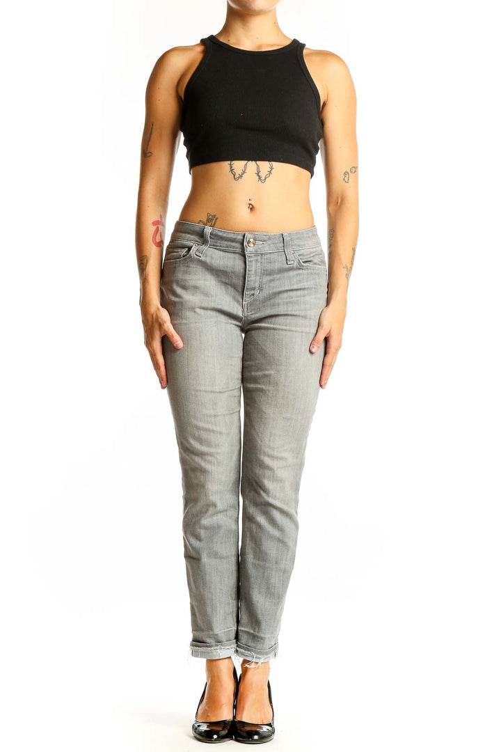 Front view of Joe's gray slim fit ankle-length jeans on model