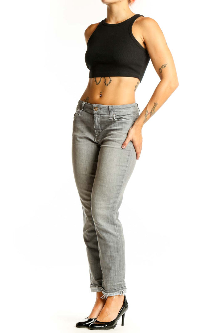 Front view of Joe's gray slim fit ankle-length jeans on model