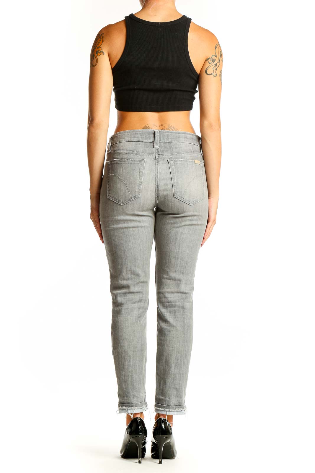 Back view of Joe's gray slim fit ankle-length jeans on model