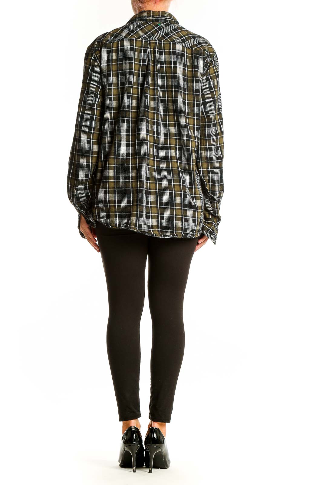 Side view of model wearing Levi's olive plaid cotton button-up shirt with black pants