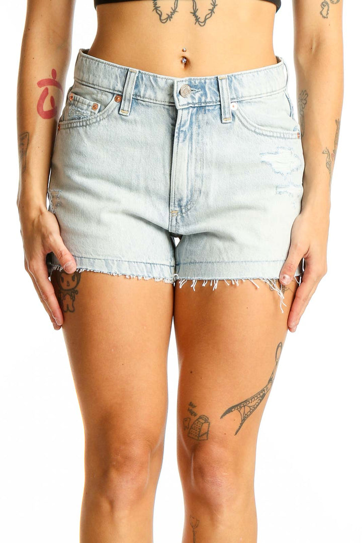 Front view of Gap light blue distressed denim shorts with frayed hem