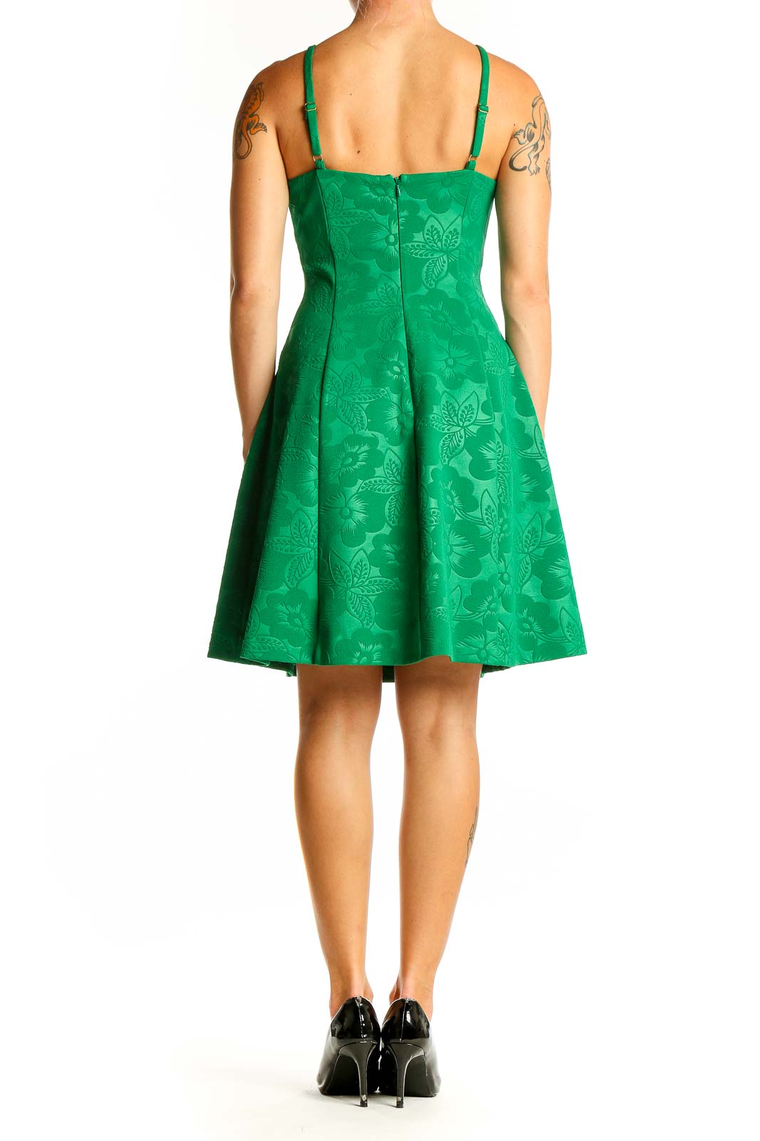 Side view of green Guess dress showing fit-and-flare silhouette and spaghetti straps
