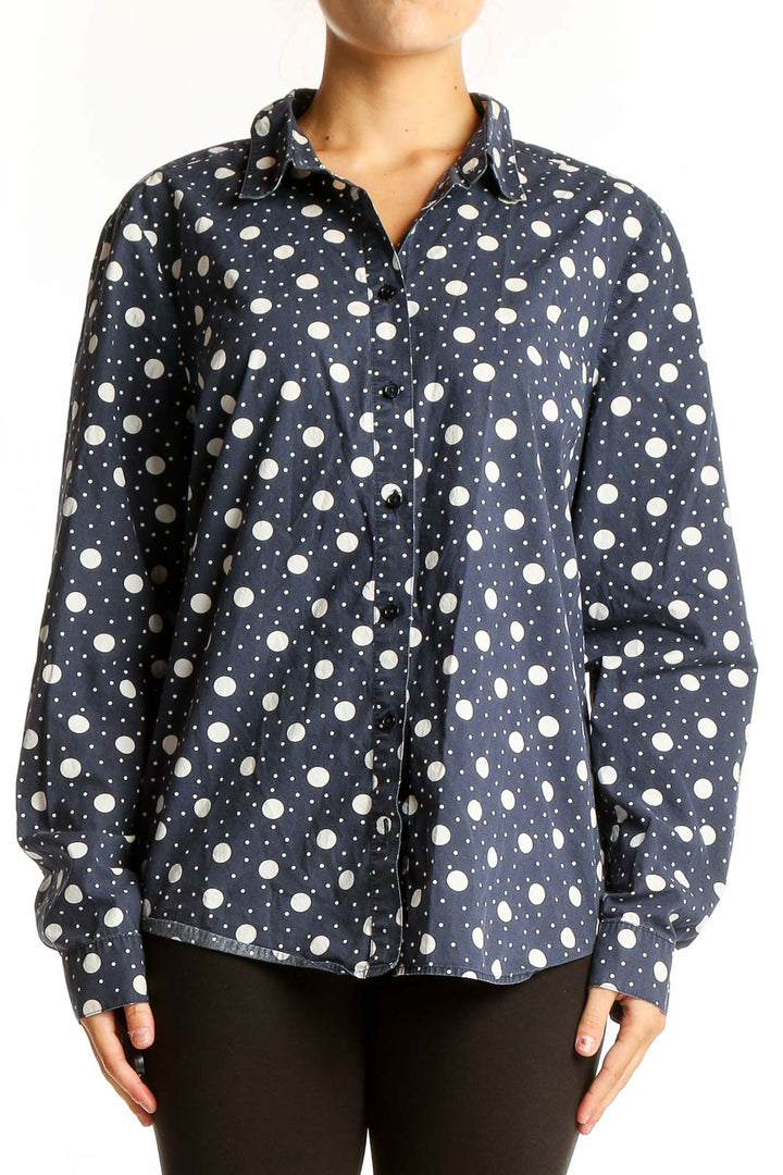 Front view of Boden navy polka dot cotton button-up shirt
