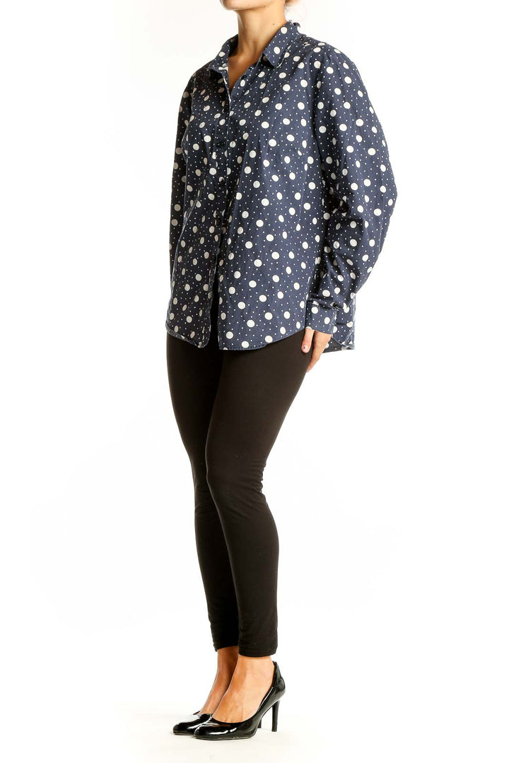 Front view of Boden navy polka dot cotton button-up shirt