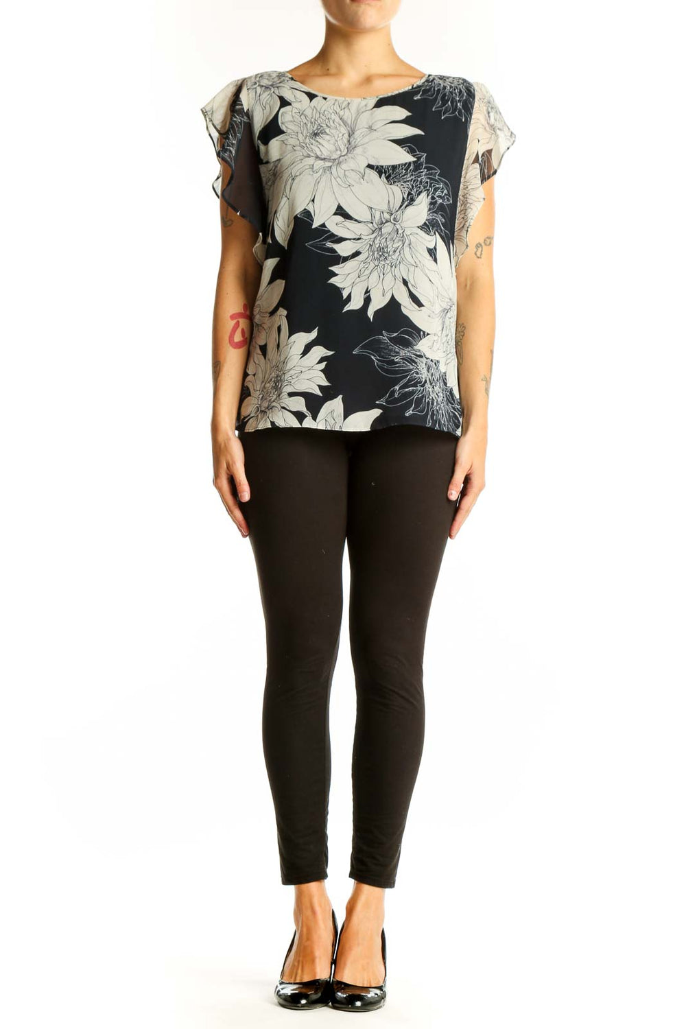 Front view of Vince Camuto black and white floral print blouse with flutter sleeves