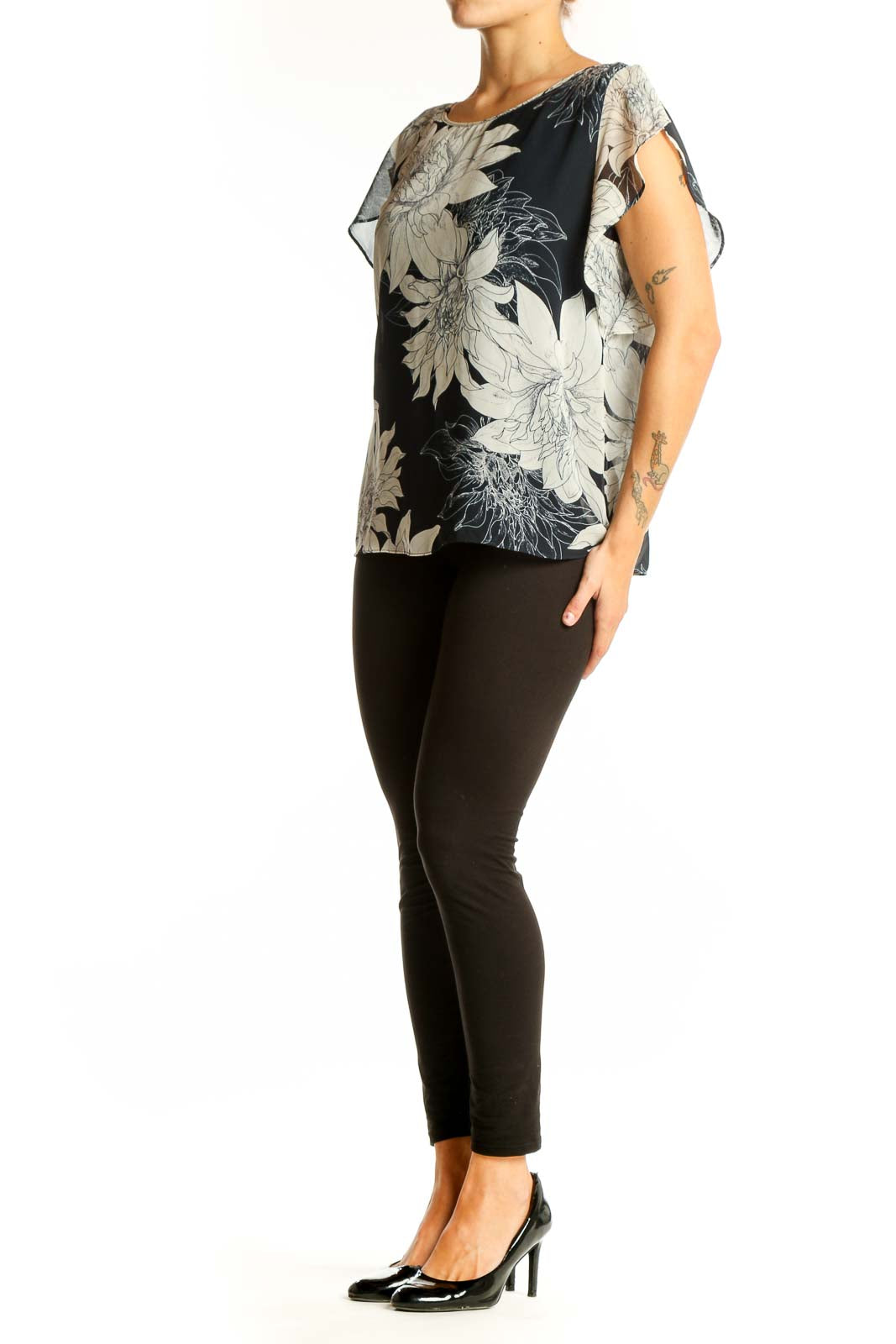 Front view of Vince Camuto black and white floral print blouse with flutter sleeves