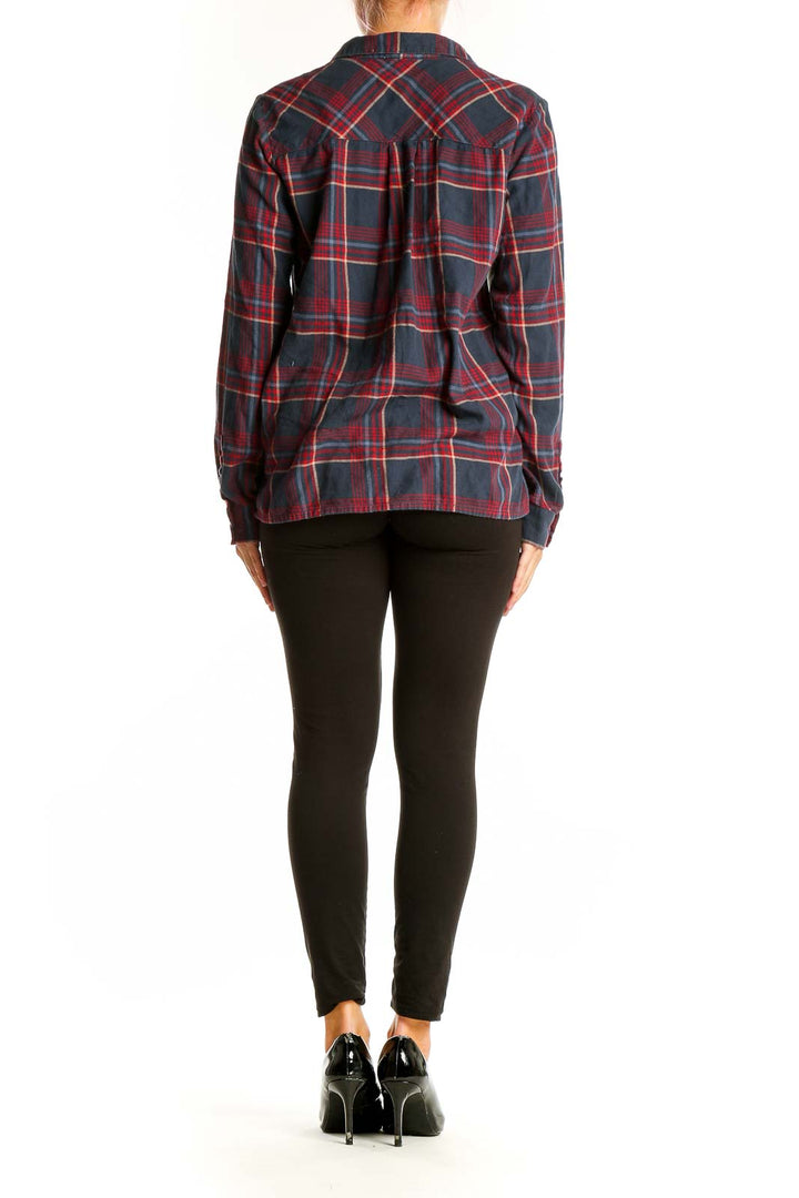 Side view of model wearing Soft Joie navy and red plaid cotton shirt
