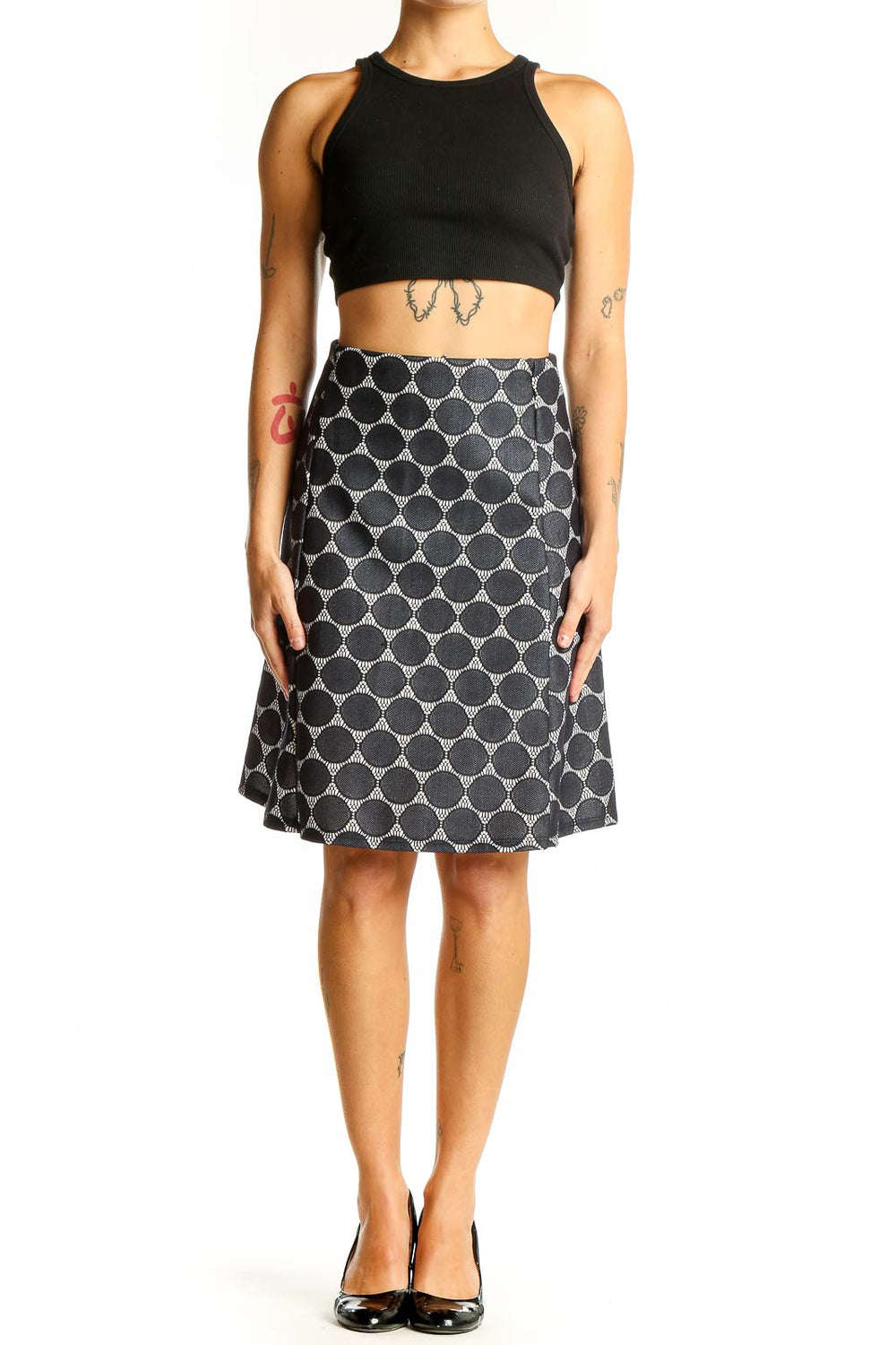 Front view of Renee C. black and white polka dot A-line skirt