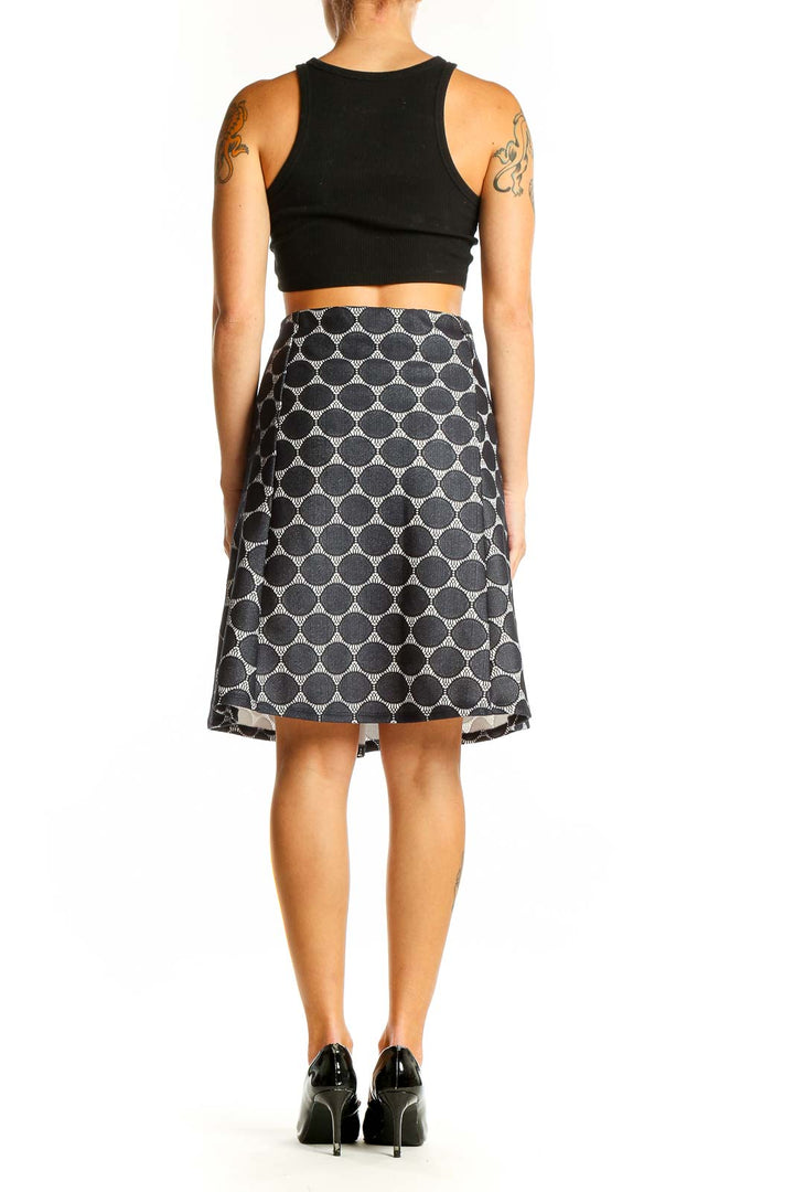 Side view of Renee C. black and white polka dot A-line skirt on model