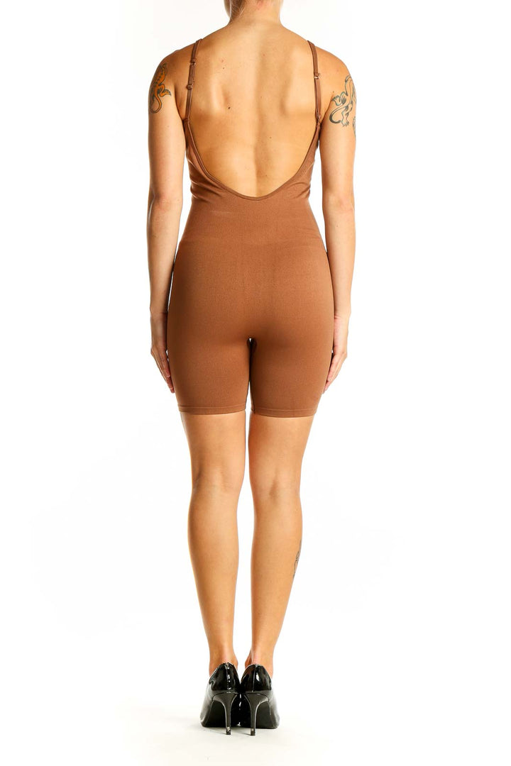 Side view of Pink Active brown bodycon jumpsuit showing sleek fit