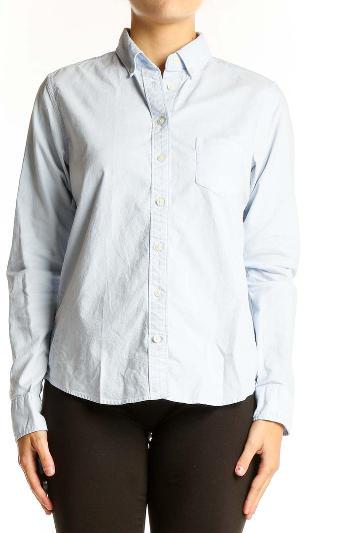 Front view of Uniqlo light blue button-down shirt with chest pocket