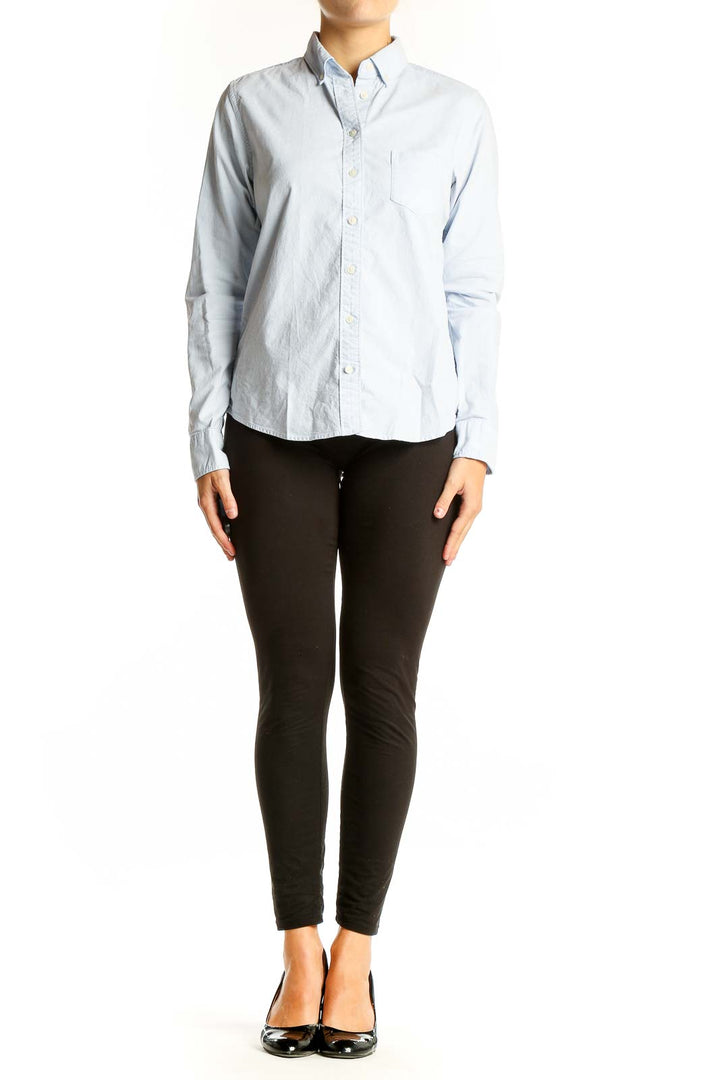 Front view of Uniqlo light blue button-down shirt with chest pocket