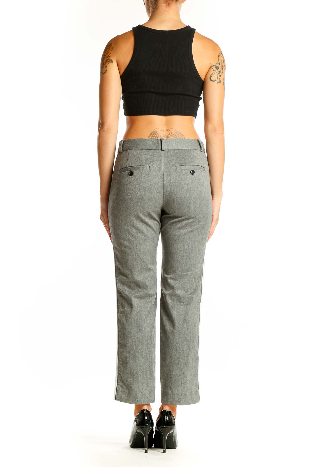 Side view of woman wearing gray cropped dress pants with black top