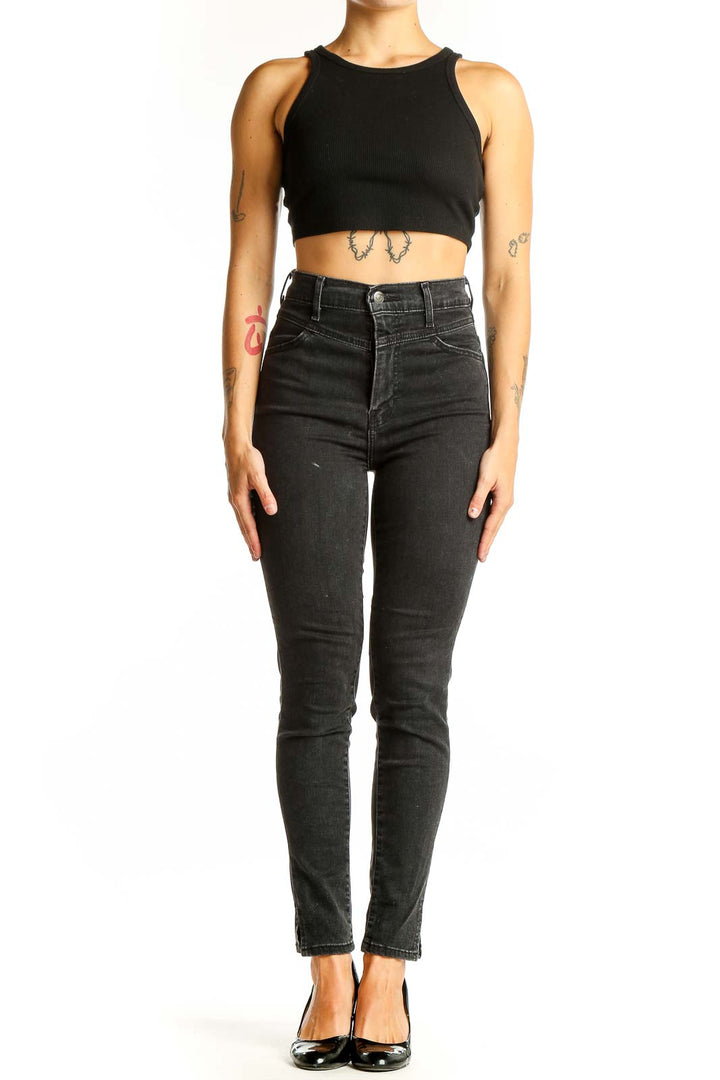 Front view of Levi's black high-waisted skinny jeans on model