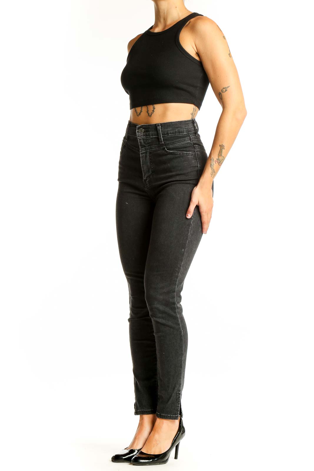 Front view of Levi's black high-waisted skinny jeans on model