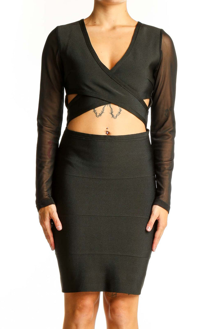Front view of black bodycon dress with cutouts and sheer sleeves