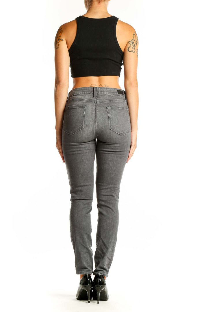 Side view of Paige gray slim fit jeans on model