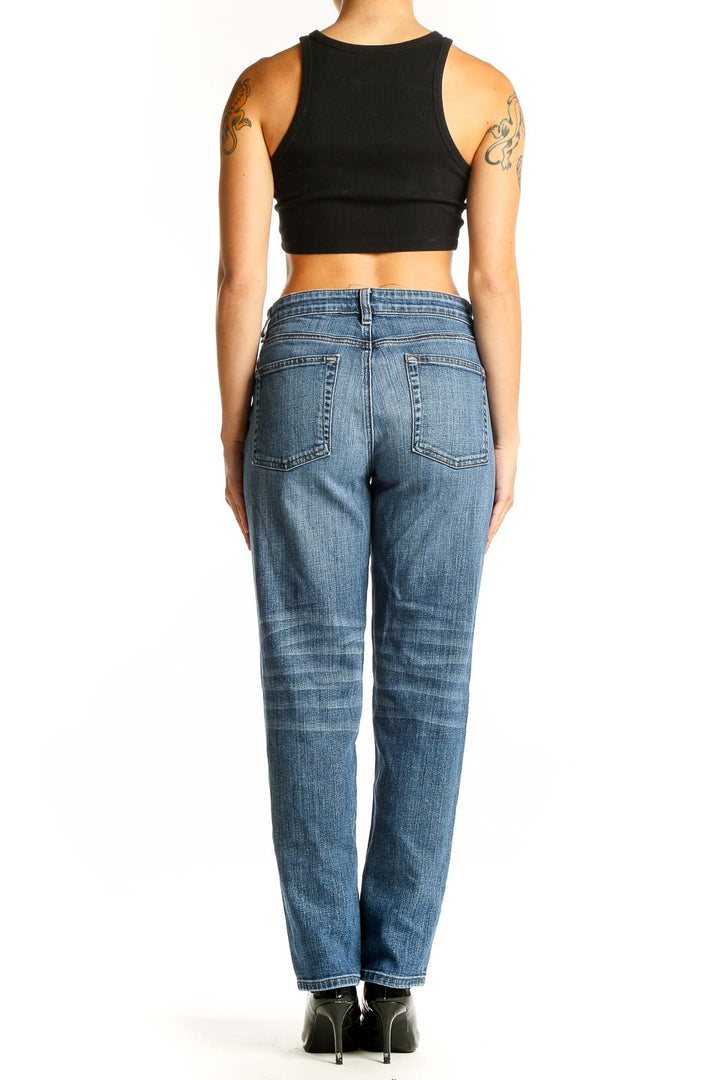 Back view of Eileen Fisher blue straight leg jeans on model