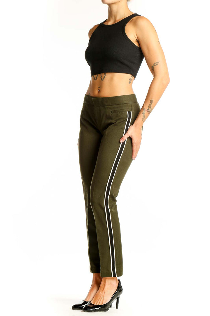 Front view of olive green Banana Republic ankle pants with side stripes